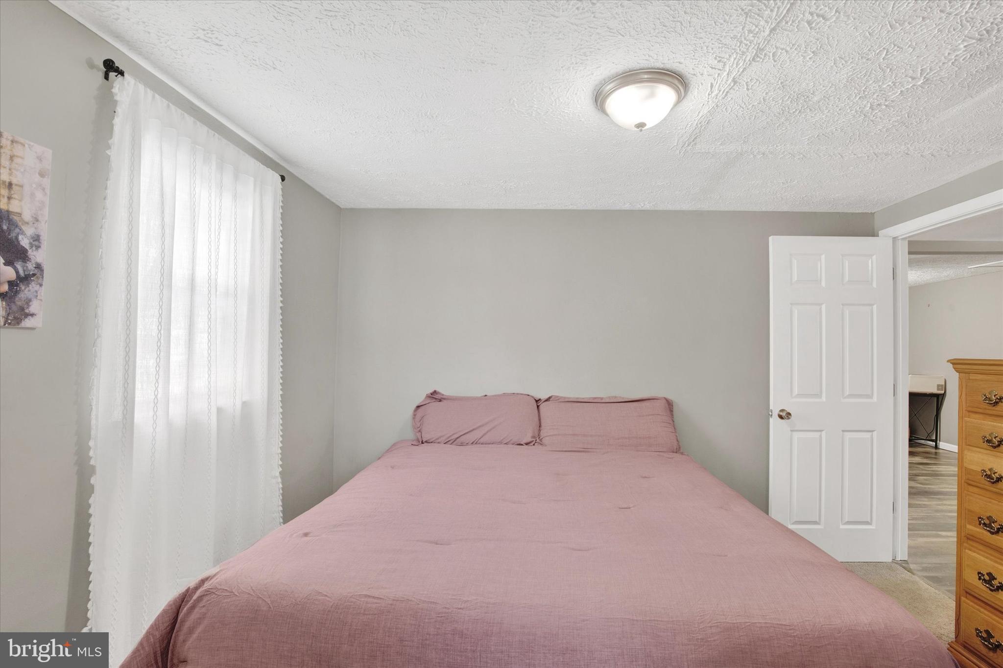 228 Porters Bridge Road Colora, MD 21917 - Photo 13 of 29 a bedroom with a bed and a window