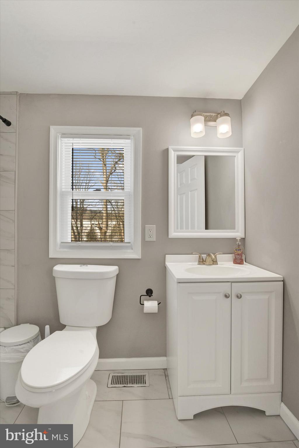 228 Porters Bridge Road Colora, MD 21917 - Photo 14 of 29 a bathroom with a toilet sink and mirror
