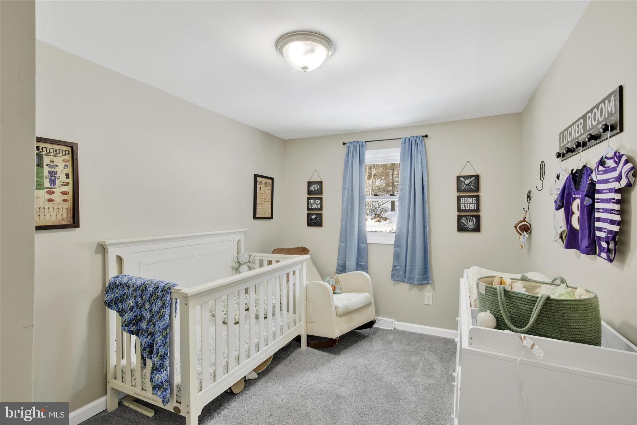 228 Porters Bridge Road Colora, MD 21917 - Photo 18 of 29 a living room with furniture and a baby crib