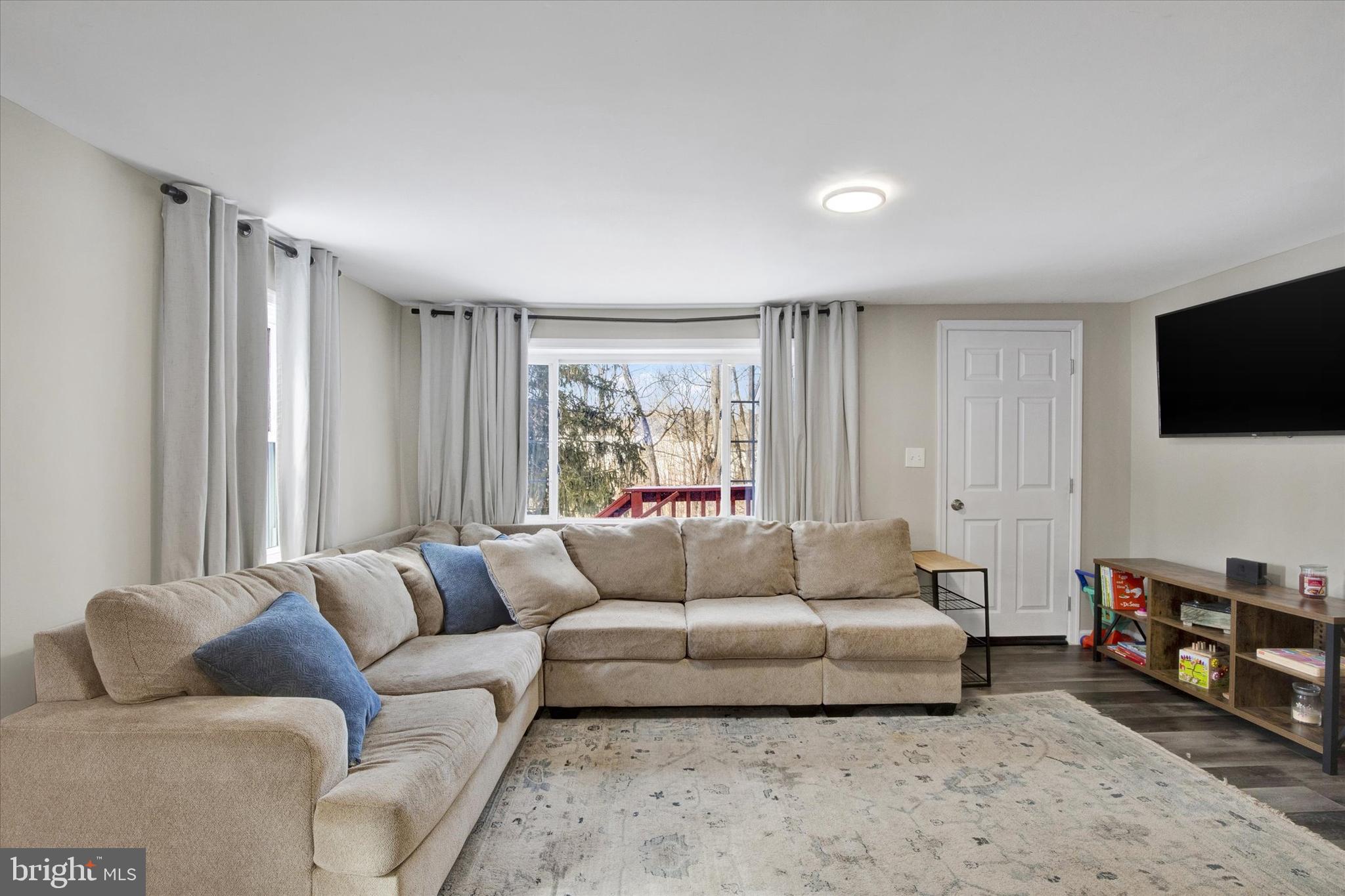 228 Porters Bridge Road Colora, MD 21917 - Photo 5 of 29 a living room with furniture and a flat screen tv