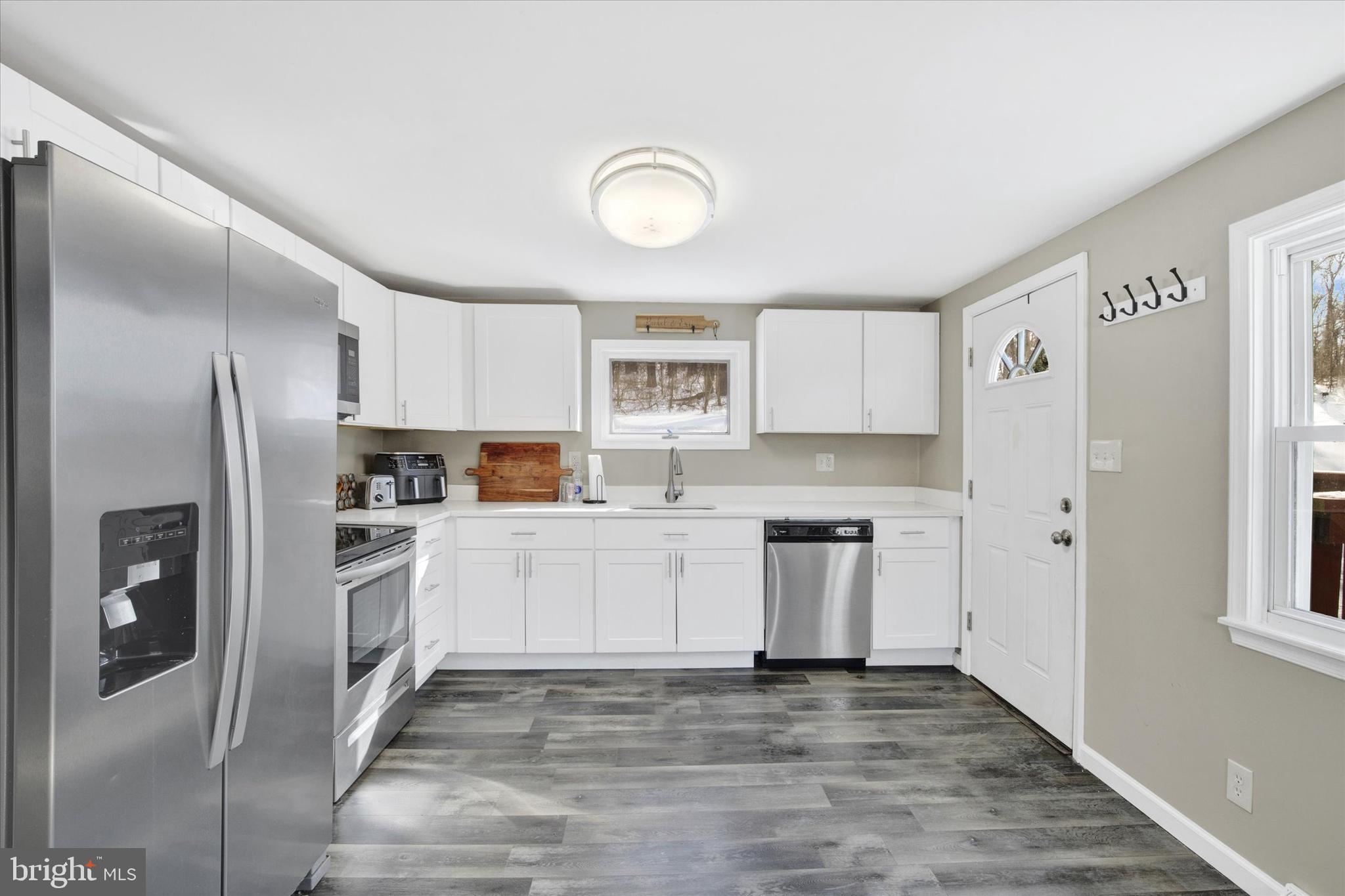 228 Porters Bridge Road Colora, MD 21917 - Photo 6 of 29 a kitchen with stainless steel appliances granite countertop a refrigerator and a stove top oven