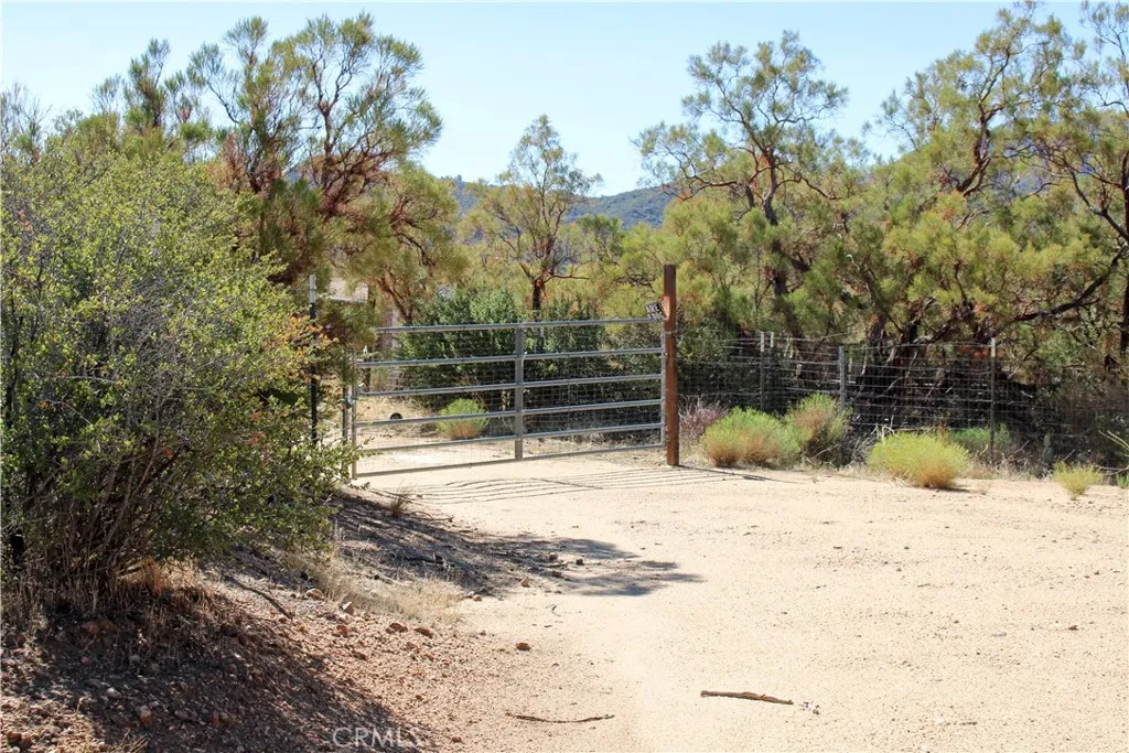 52 Trails End Lane Anza, CA 92539 - Photo 12 of 18 a view of a yard covered with snow in front of house