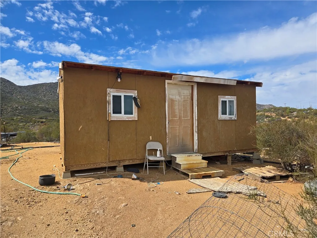 52 Trails End Lane Anza, CA 92539 - Photo 3 of 18 a backyard of a house with table and chairs