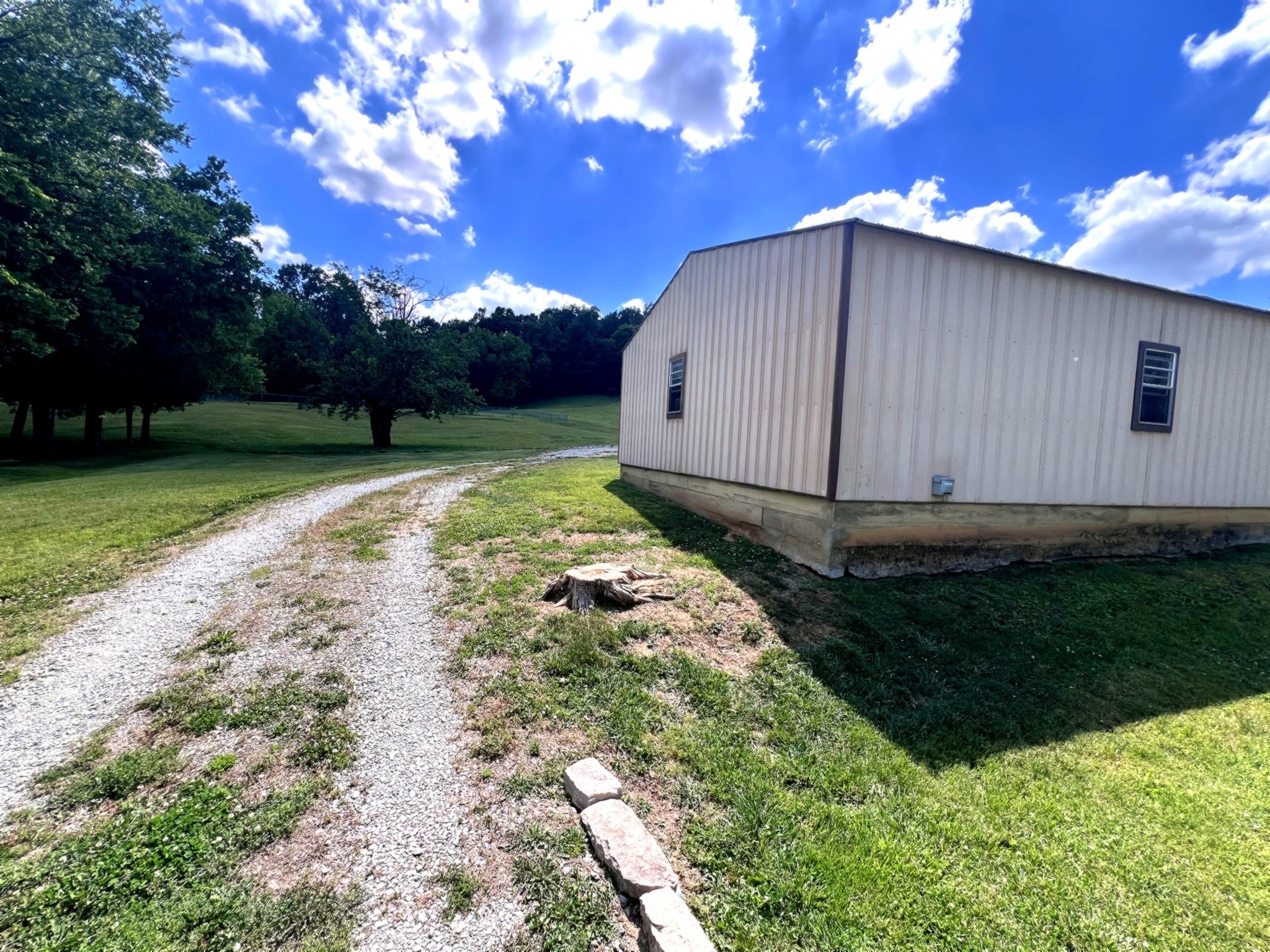 1133 Culps Bend Road Clifton, TN 38425 - Photo 29 of 51 a backyard of a house with lots of green space