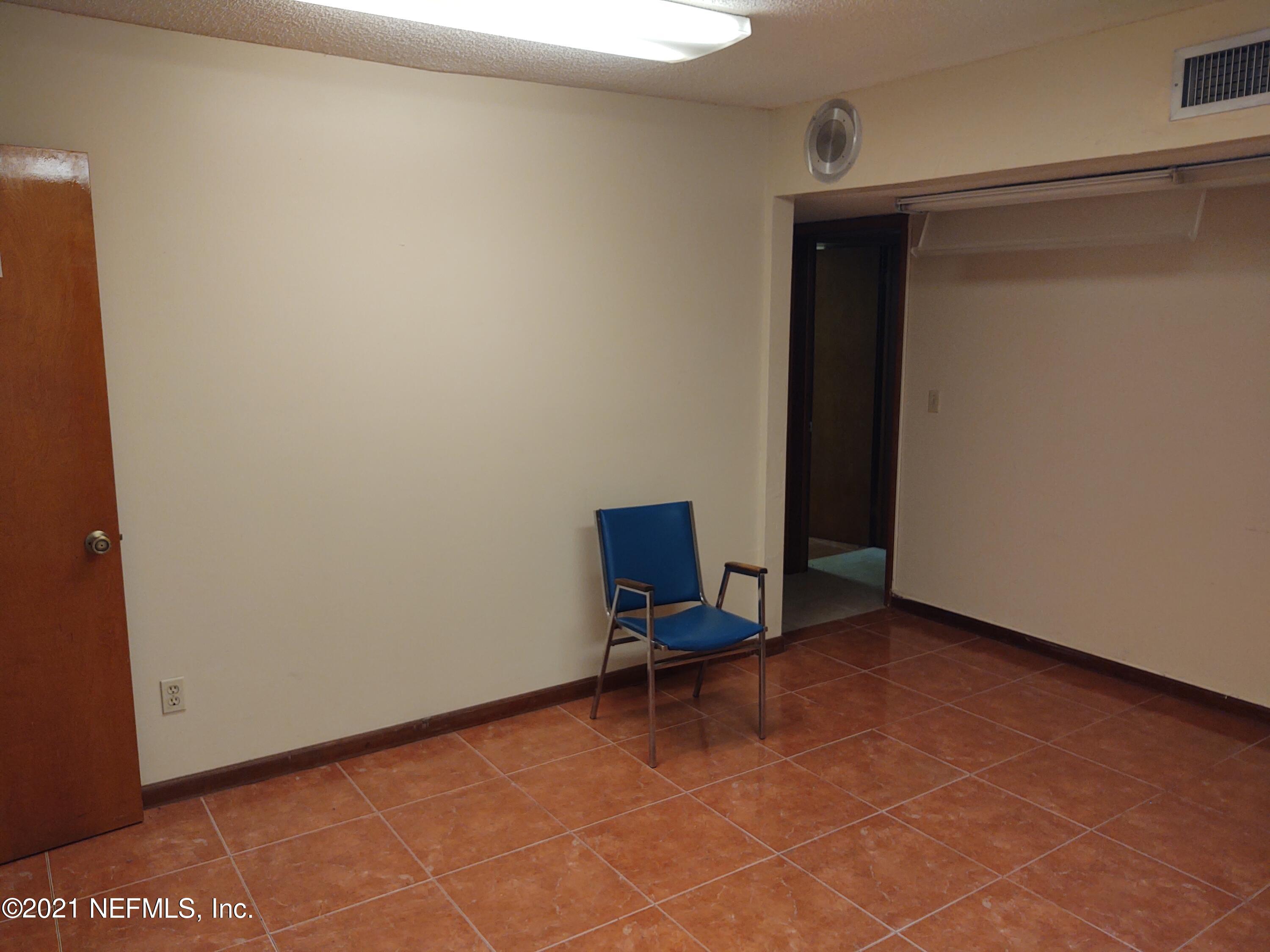 6919 Merrill Road Jacksonville, FL 32277 - Photo 17 of 19 a view of room with window and a table