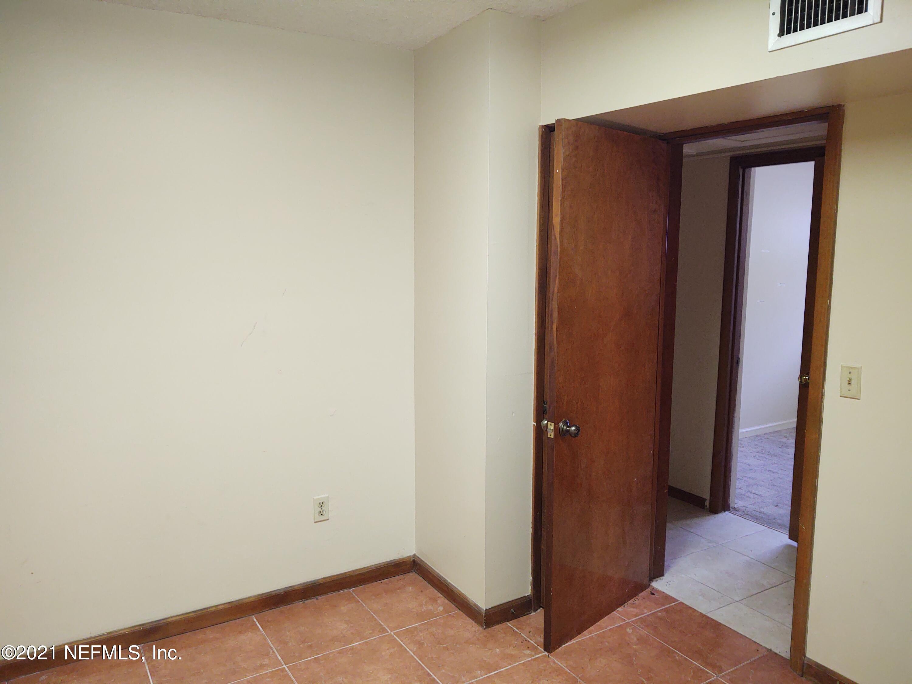 6919 Merrill Road Jacksonville, FL 32277 - Photo 8 of 19 a view of a hallway with closet
