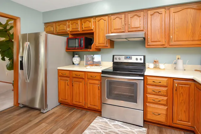 a view of a livingroom with furniture and a window