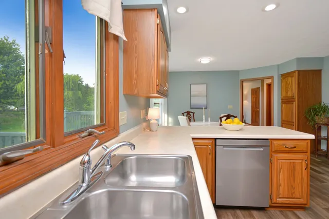 a view of a livingroom with furniture and a potted plant