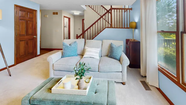 a bedroom with a bed and dresser with mirror