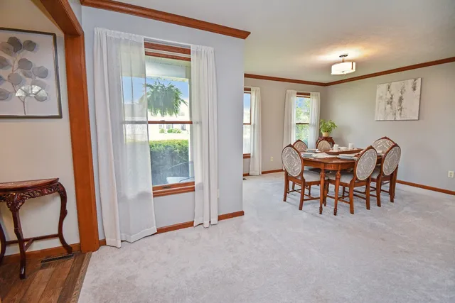 a bathroom with a granite countertop toilet sink and mirror