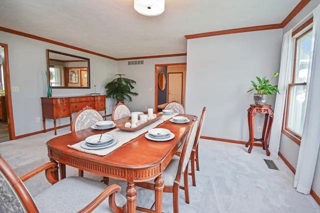 a white toilet sitting next to a small bathroom