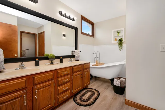 a bedroom with a bed and a potted plant