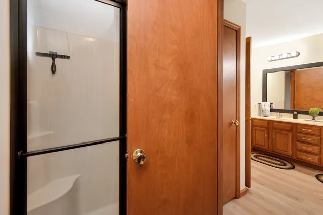 a bedroom with a bed and a dresser