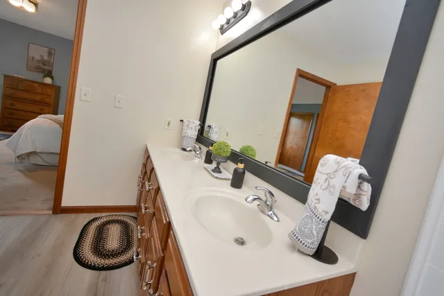 a bedroom with a bed and a dresser