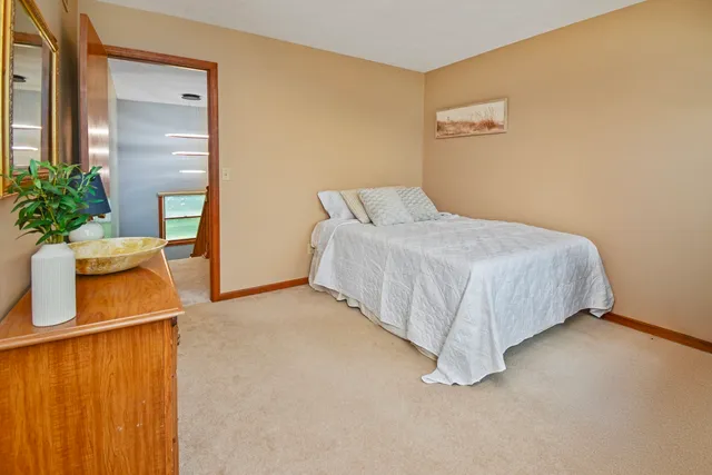 a view of a hallway and a livingroom with furniture