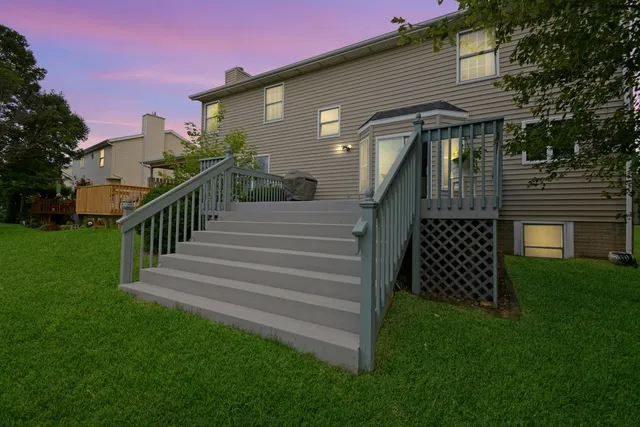 a view of a balcony with two chairs and a table