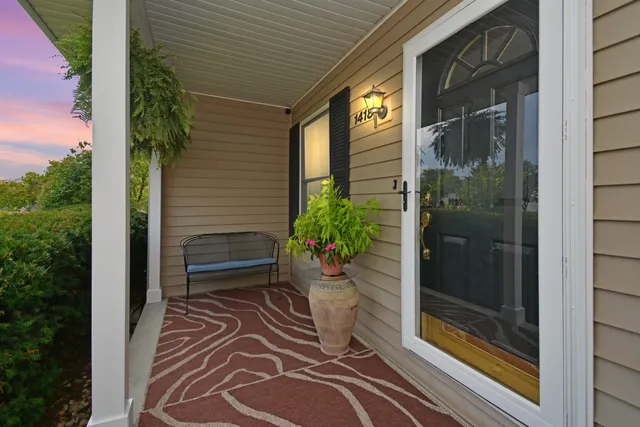 a kitchen with a sink window and cabinets