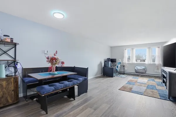 a living room with furniture and a table