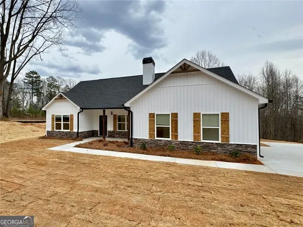 a front view of a house with yard