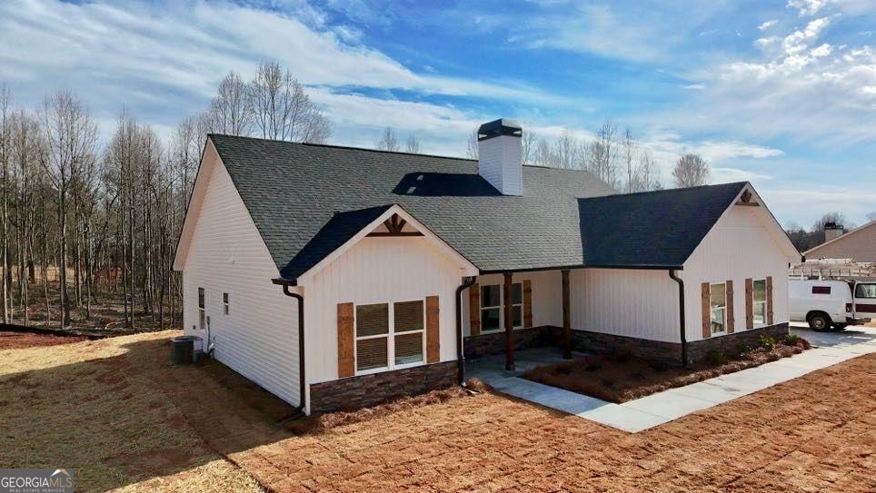 239 Cool Springs Road Clarkesville, GA 30523 - Photo 12 of 37 a front view of a house with a yard