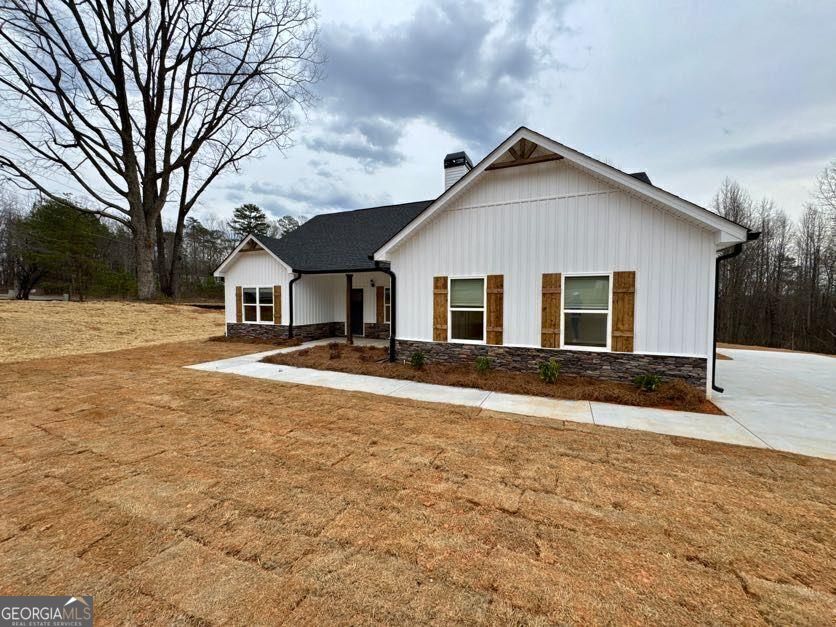 239 Cool Springs Road Clarkesville, GA 30523 - Photo 4 of 37 a view of a yard in front of a house with large trees