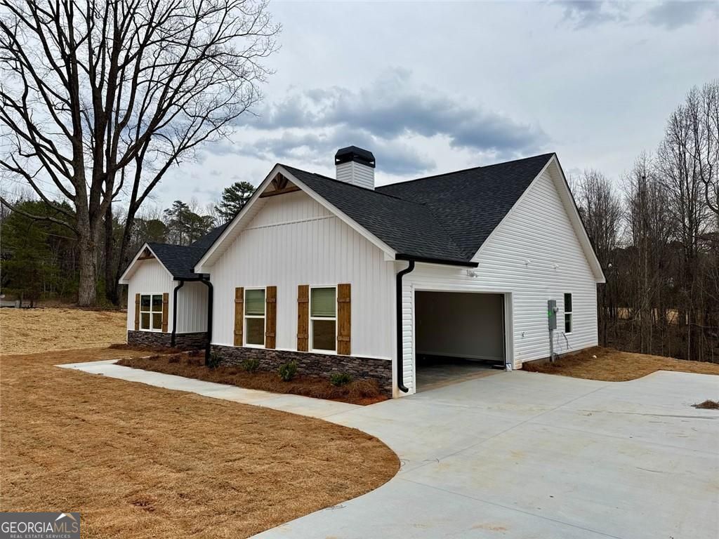 239 Cool Springs Road Clarkesville, GA 30523 - Photo 6 of 37 a front view of house with yard and trees in the background