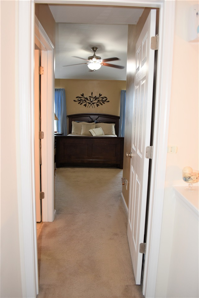 351 Gilman Lane, Unit 102 Raleigh, NC 27610 - Photo 14 of 18 Entering the resort style suite! Are you ready for rest and relaxation. Master bath is to the left. Third Floor Hallway