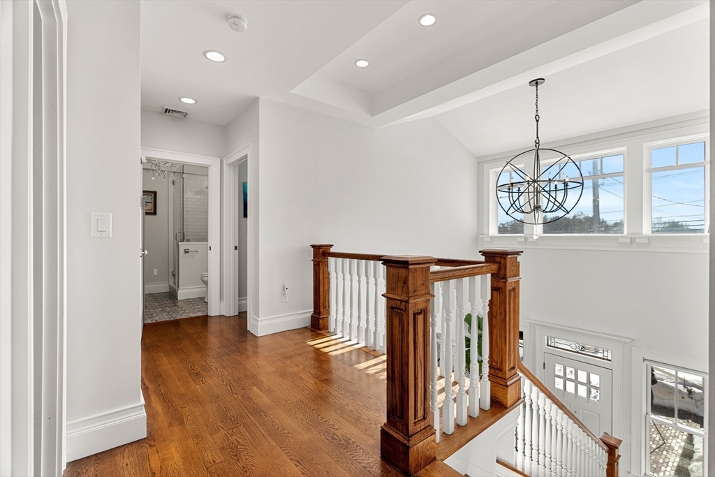 105 High Road, Unit 105 Newbury, MA 01951 - Photo 27 of 42 a view of a hallway view with wooden floor and staircase