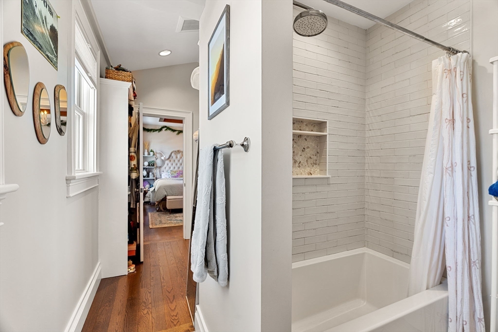 105 High Road, Unit 105 Newbury, MA 01951 - Photo 35 of 42 a bathroom with a bathtub and a shower