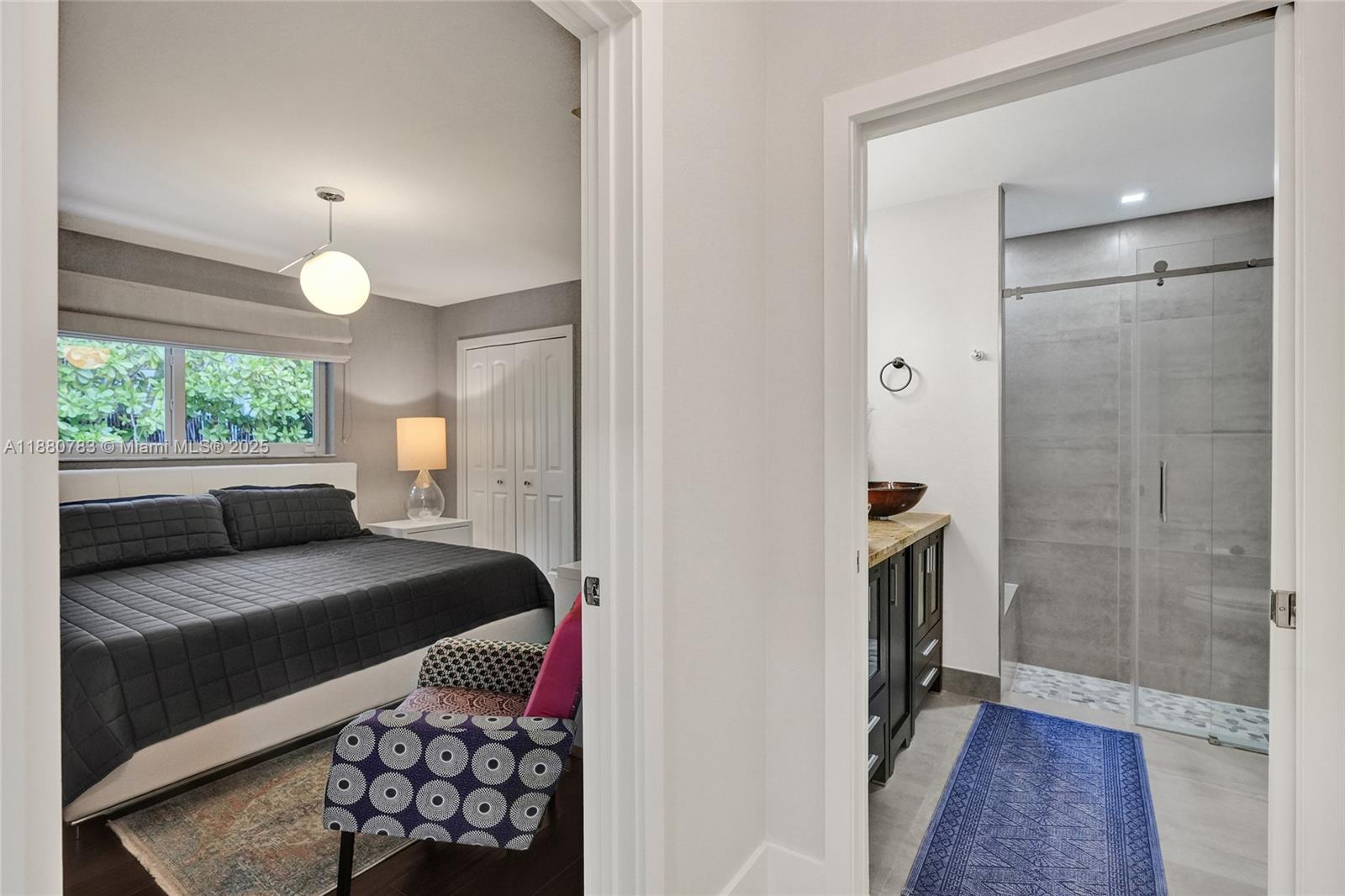 910 Southwest 23rd Road Miami, FL 33129 - Photo 20 of 62 a bedroom with a bed and a window