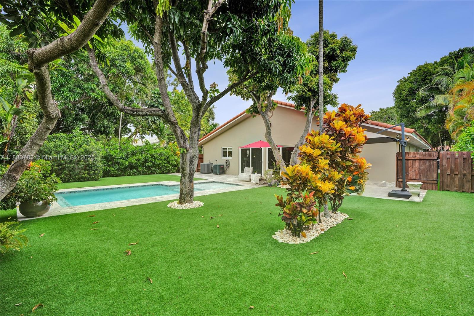 910 Southwest 23rd Road Miami, FL 33129 - Photo 3 of 62 a garden with trees in front of it