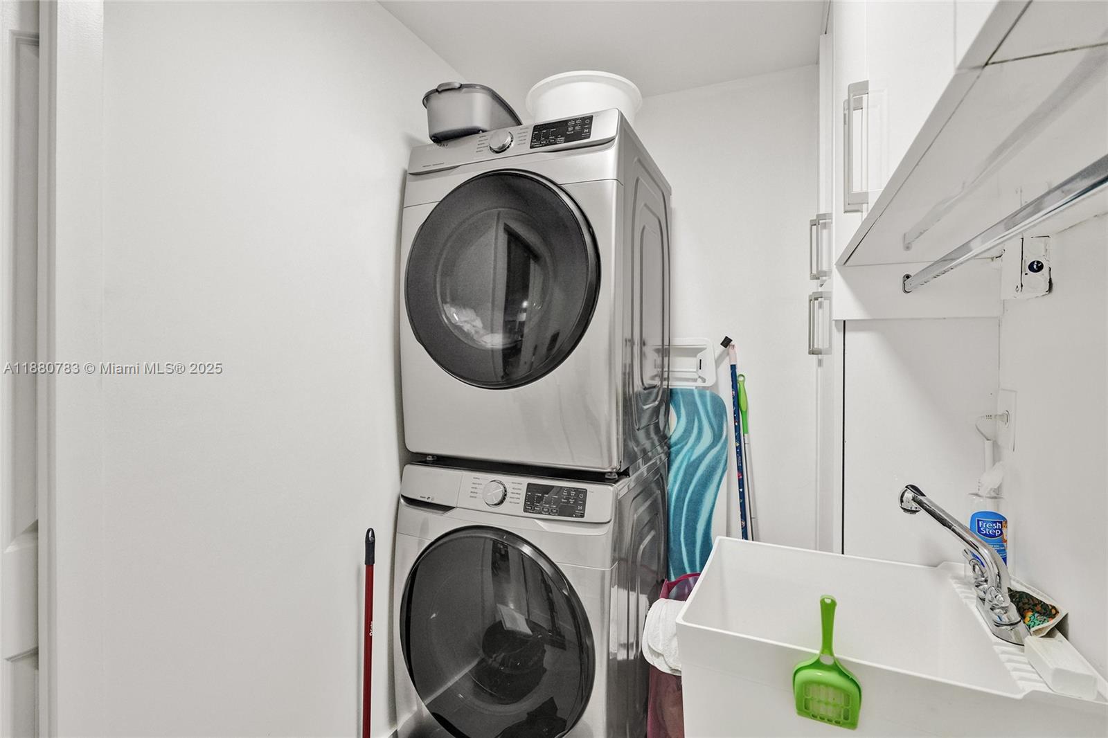 910 Southwest 23rd Road Miami, FL 33129 - Photo 48 of 62 a utility room with dryer and washer