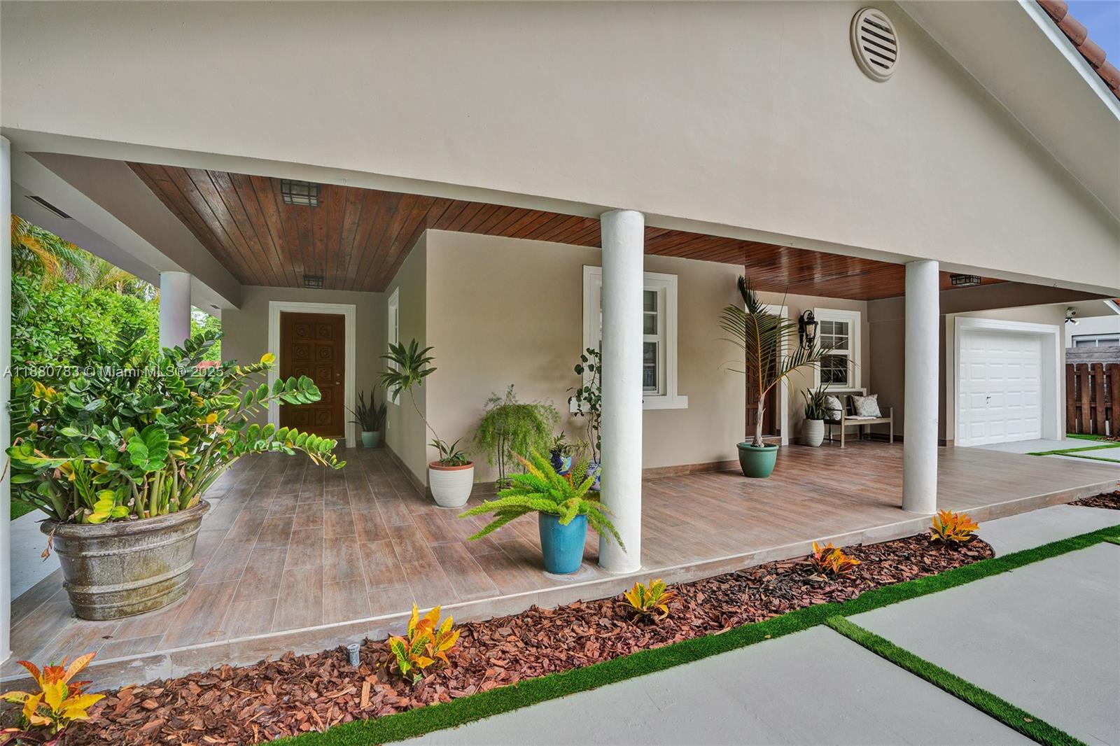 910 Southwest 23rd Road Miami, FL 33129 - Photo 54 of 62 a front view of a house with a porch