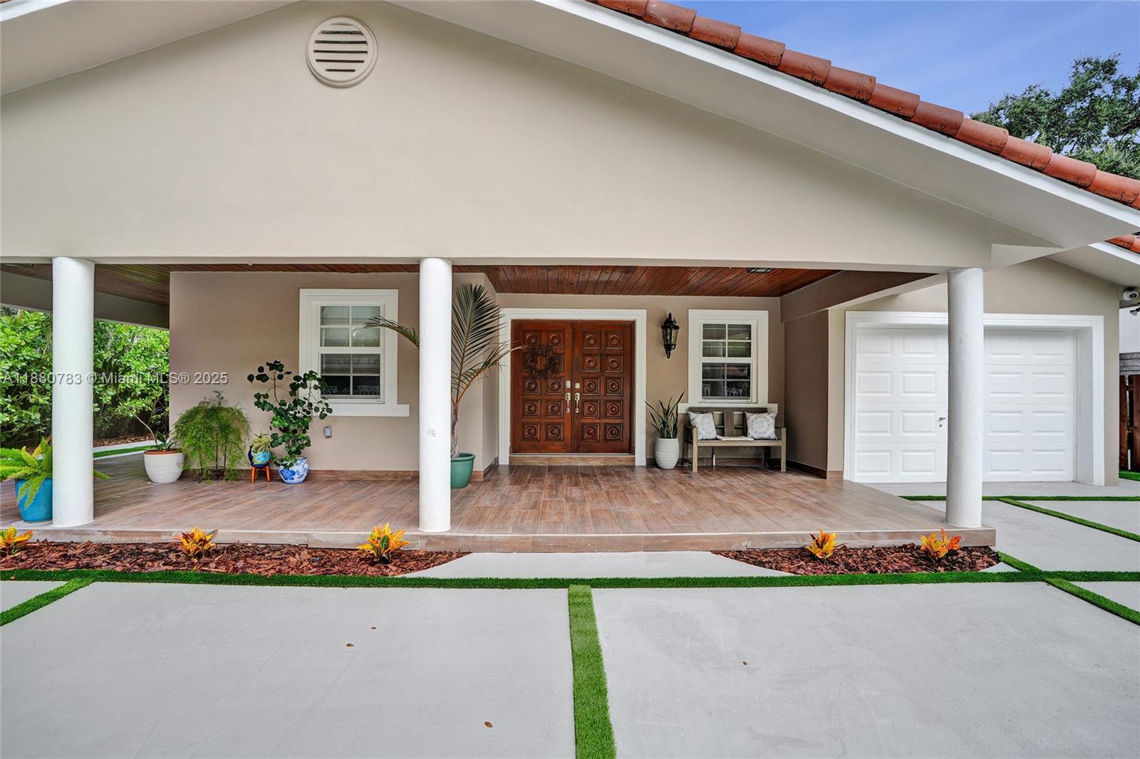 910 Southwest 23rd Road Miami, FL 33129 - Photo 8 of 62 a front view of house with yard and seating space