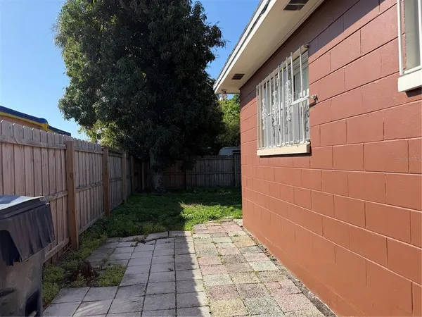 a view of a pathway both side of house