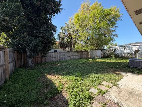 a backyard of a house with lots of green space