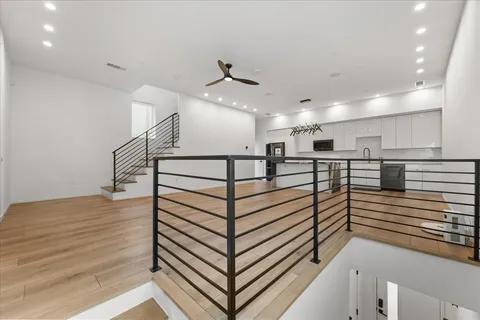 a view of a kitchen with a sink and a refrigerator