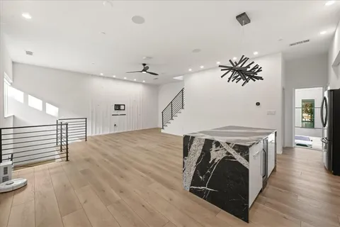 a view of kitchen and wooden floor
