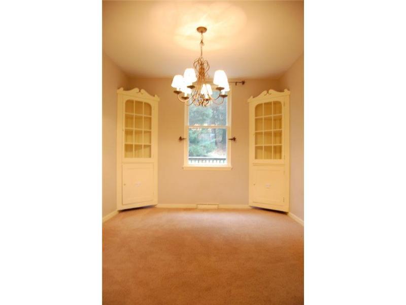 Dining Room. Built in corner cabinets add to the charm of this home. Neutral shades mix well with all designs.