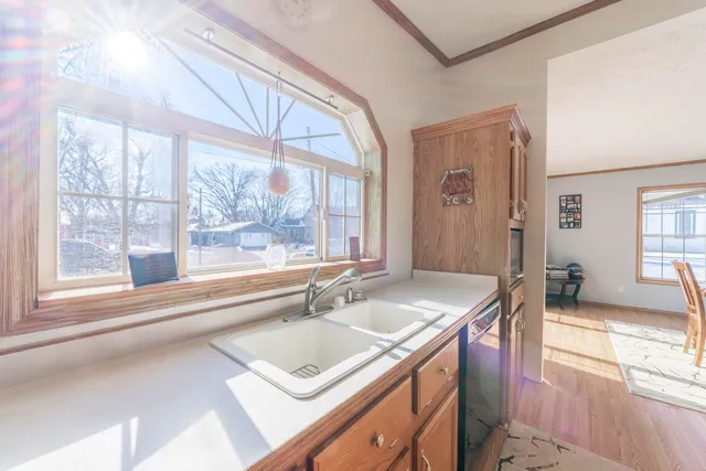 a kitchen with stainless steel appliances granite countertop a stove and a sink