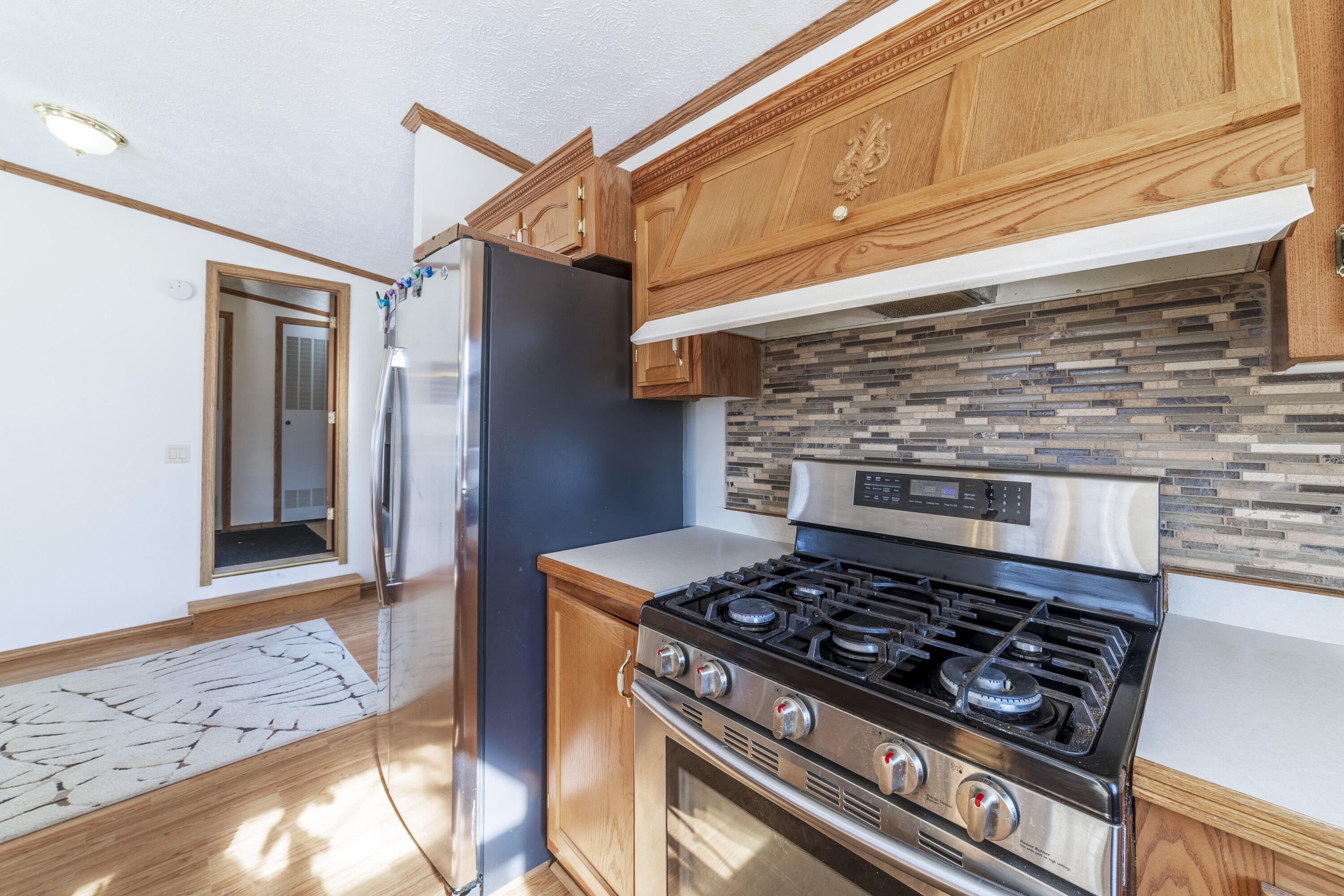 409 South Street Hebron, IN 46341 - Photo 15 of 36 a stove top oven sitting inside of a kitchen