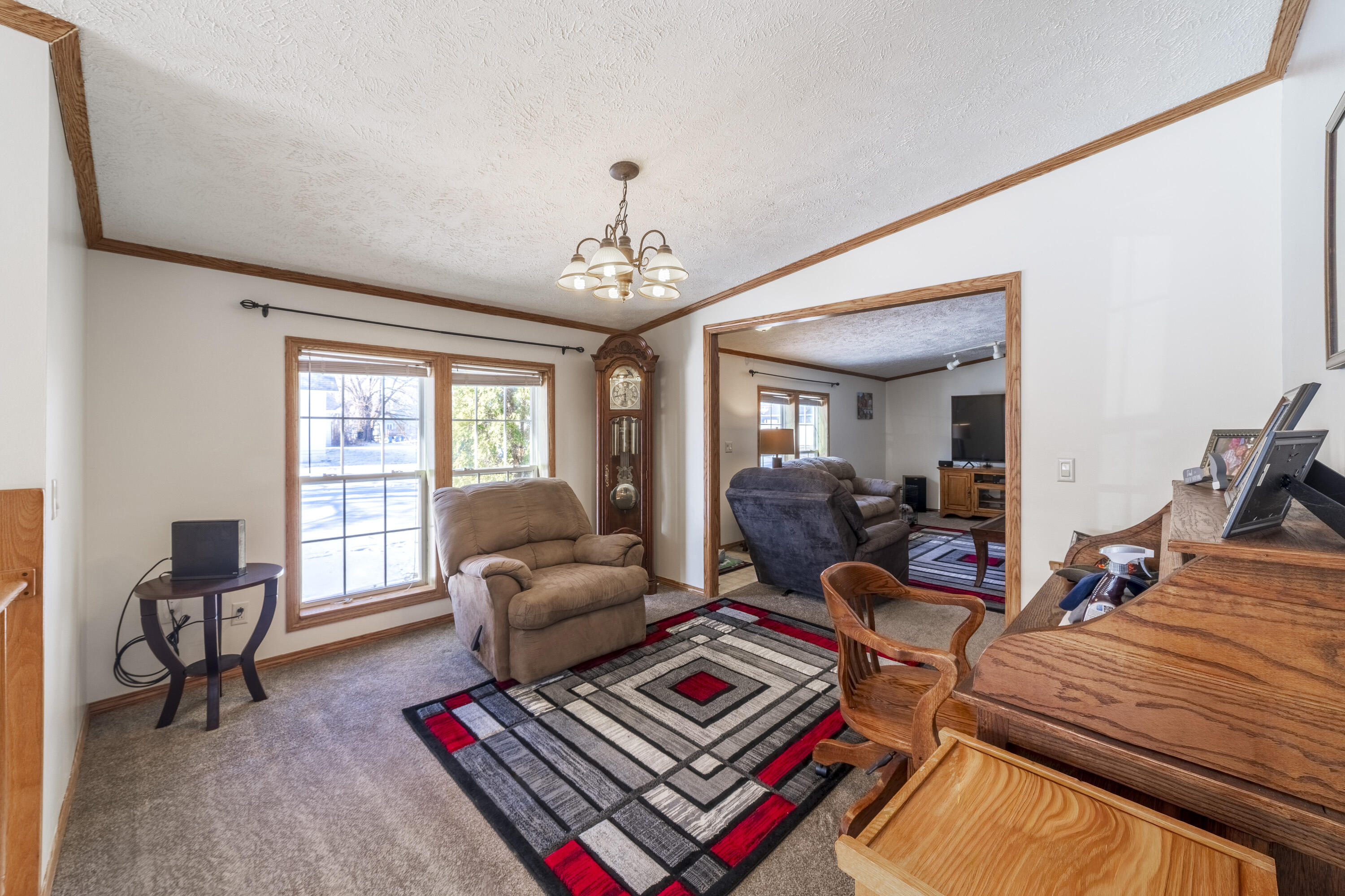 409 South Street Hebron, IN 46341 - Photo 18 of 36 a living room with furniture a rug and a window