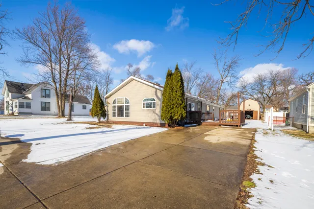 a view of a house with a snow in front of it