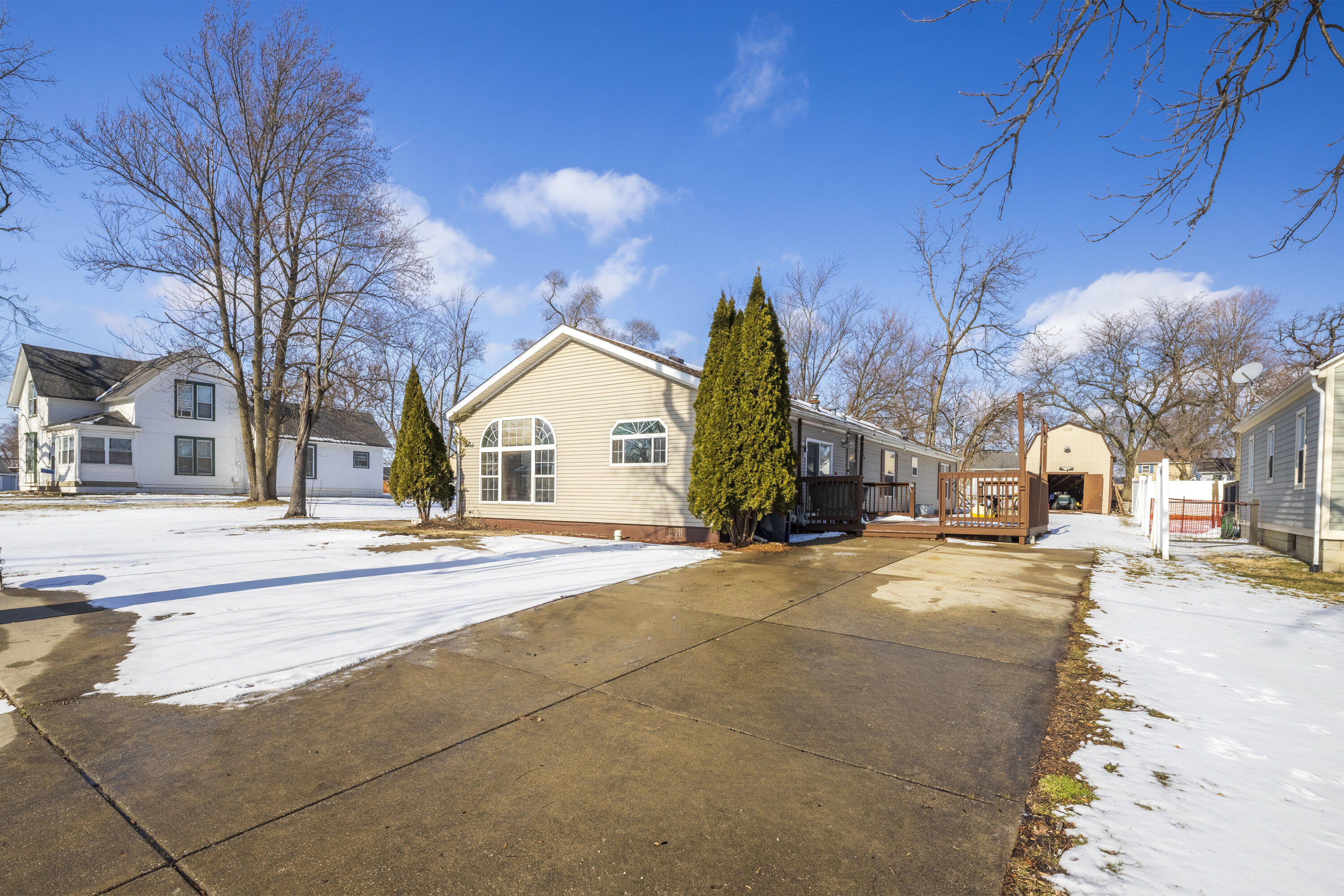 409 South Street Hebron, IN 46341 - Photo 2 of 36 a view of a house with a snow in front of it