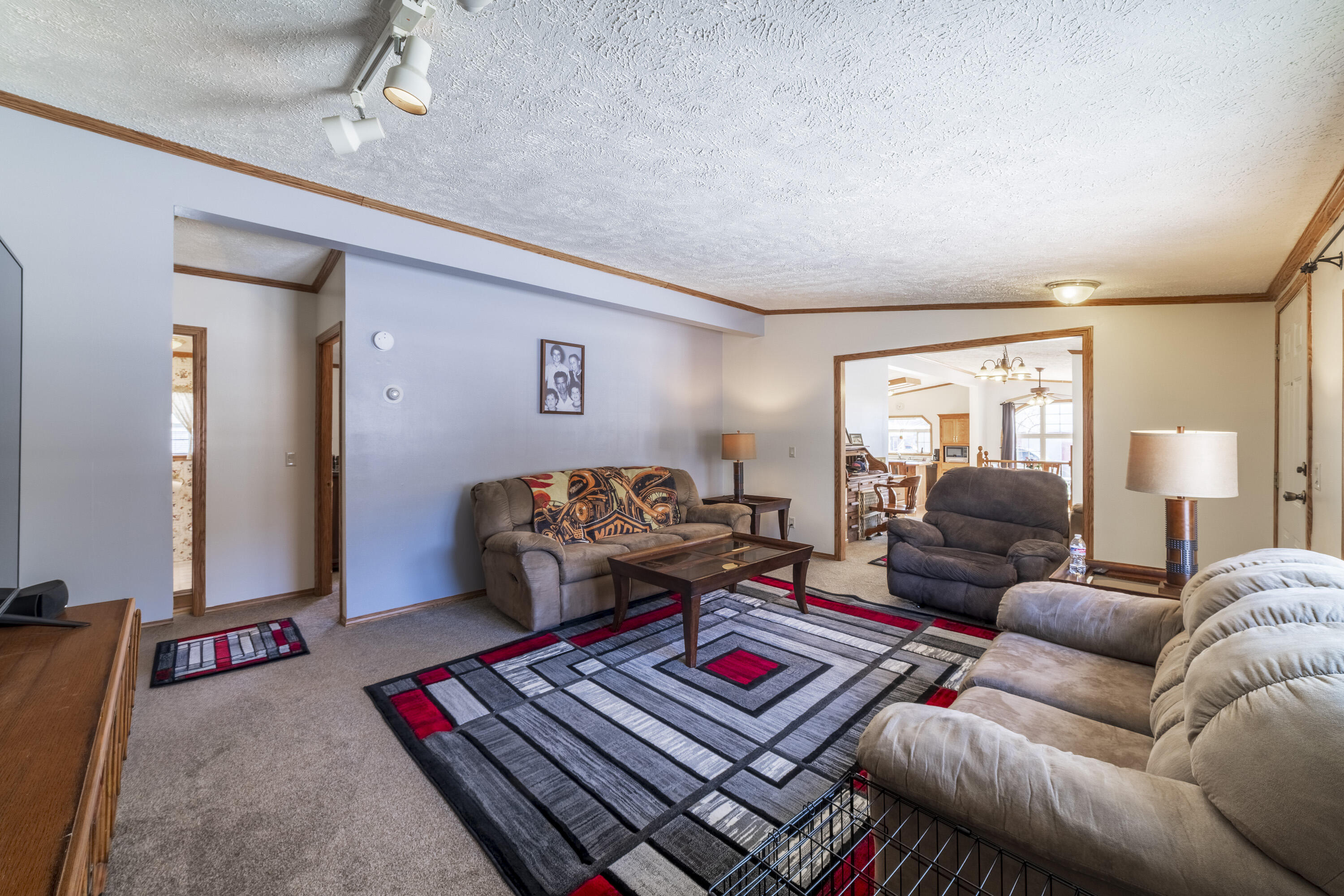 409 South Street Hebron, IN 46341 - Photo 21 of 36 a living room with furniture and a lamp