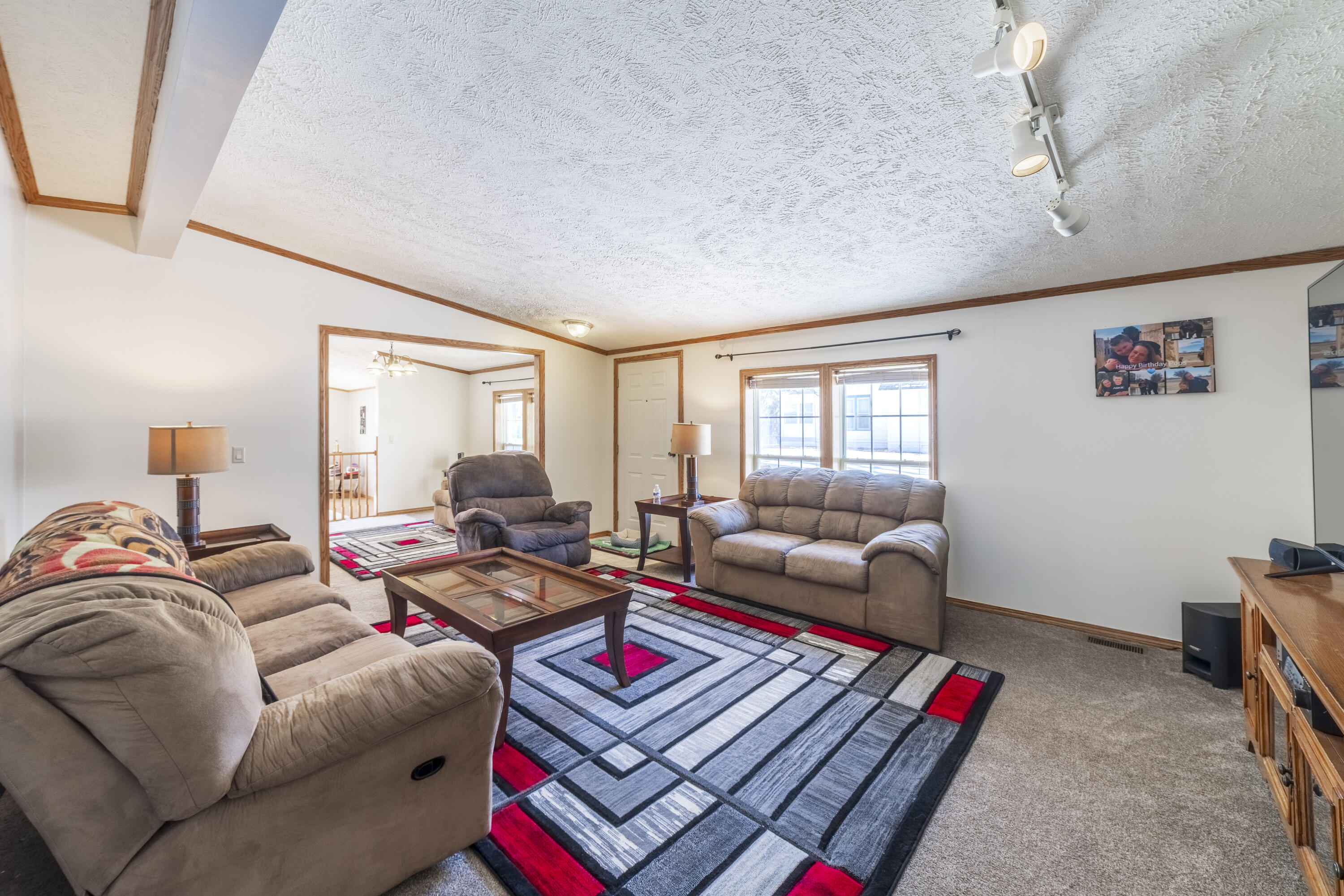 409 South Street Hebron, IN 46341 - Photo 22 of 36 a living room with furniture and a window