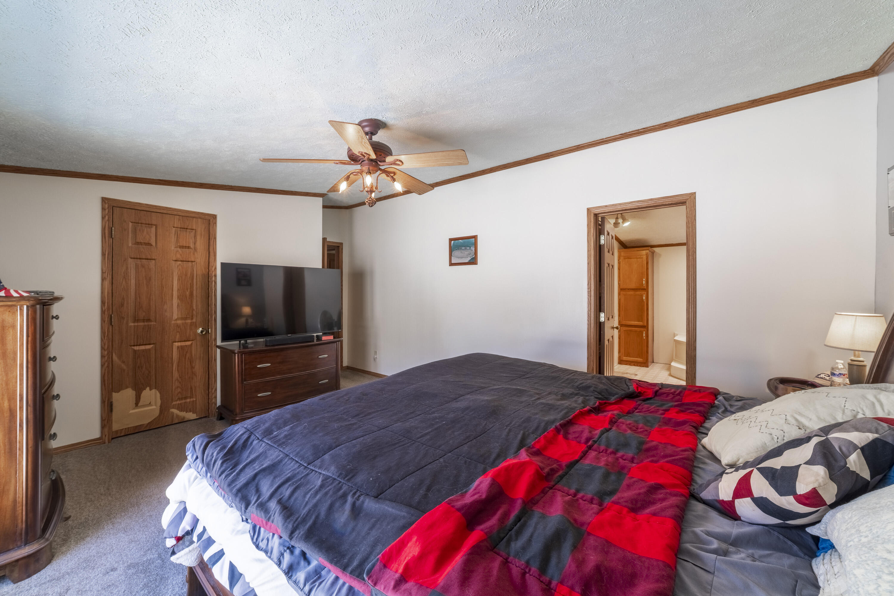 409 South Street Hebron, IN 46341 - Photo 25 of 36 a bedroom with a bed and a flat screen tv
