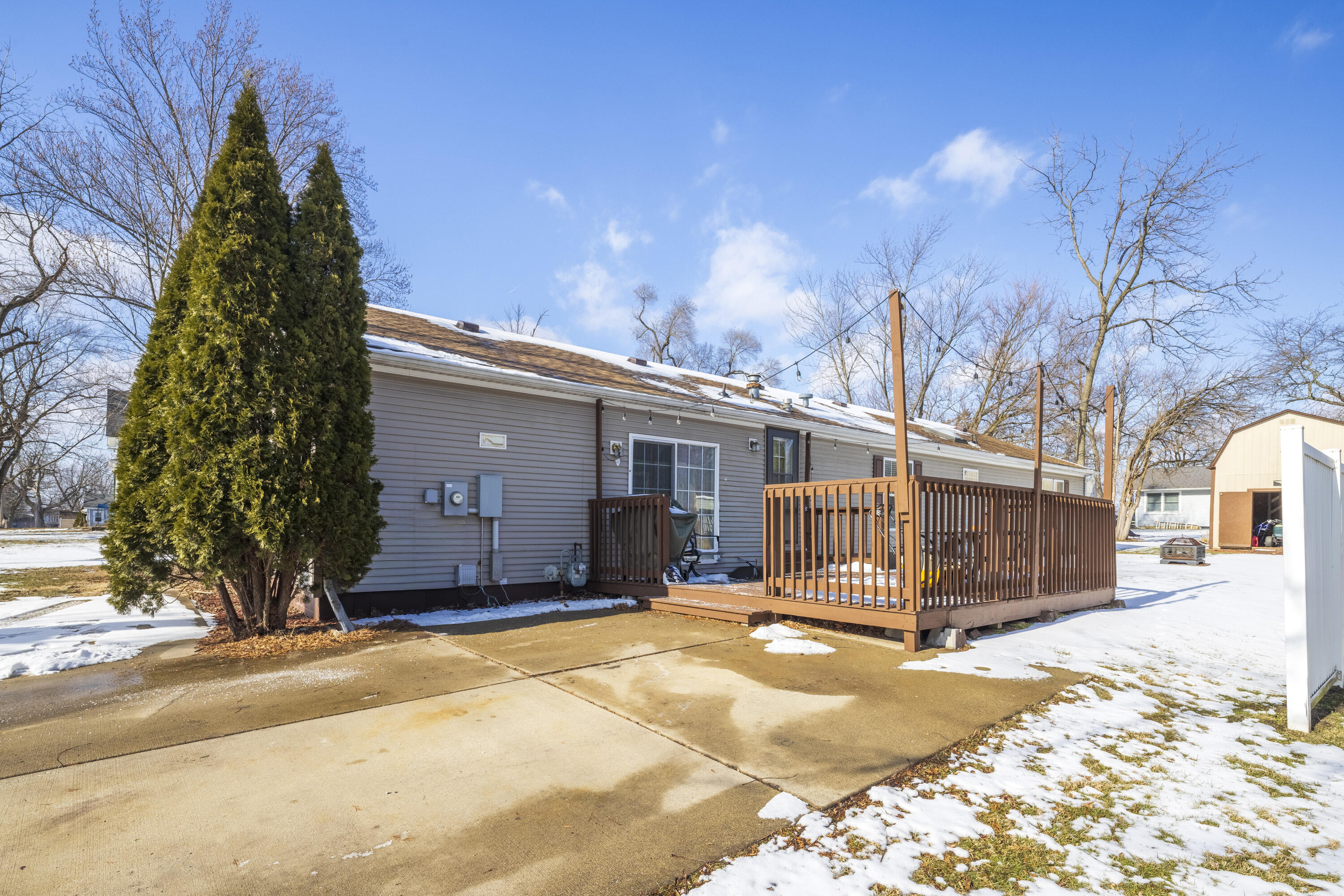 409 South Street Hebron, IN 46341 - Photo 3 of 36 a view of a house with a backyard