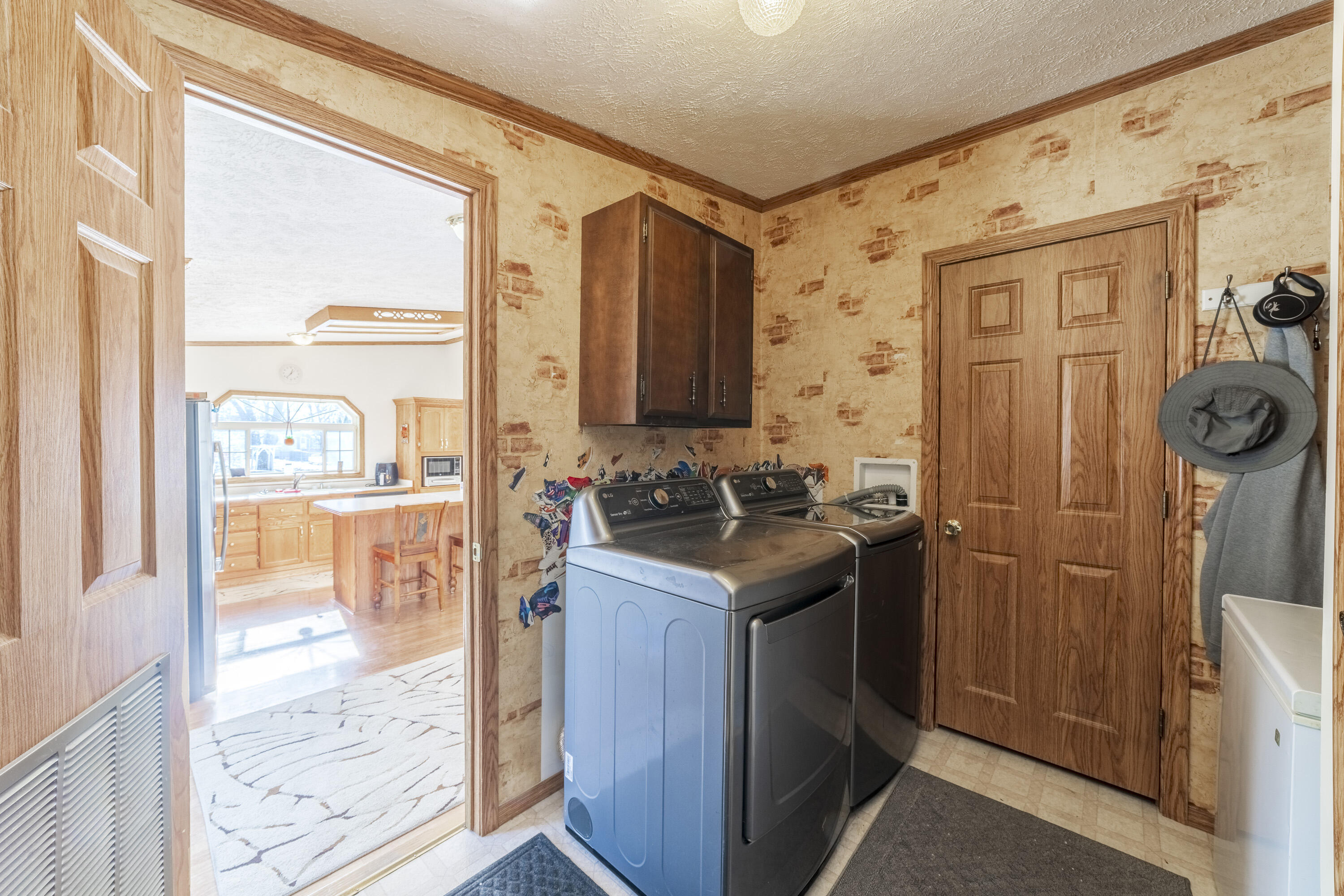 409 South Street Hebron, IN 46341 - Photo 35 of 36 a kitchen with granite countertop a sink and a refrigerator