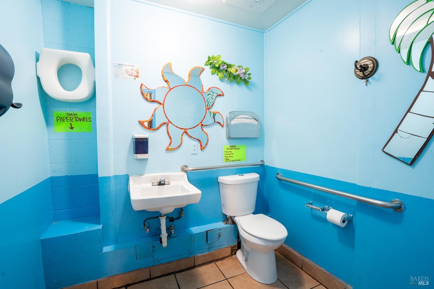 111 South State Street Ukiah, CA 95482 - Photo 14 of 14 a bathroom with a toilet sink and mirror